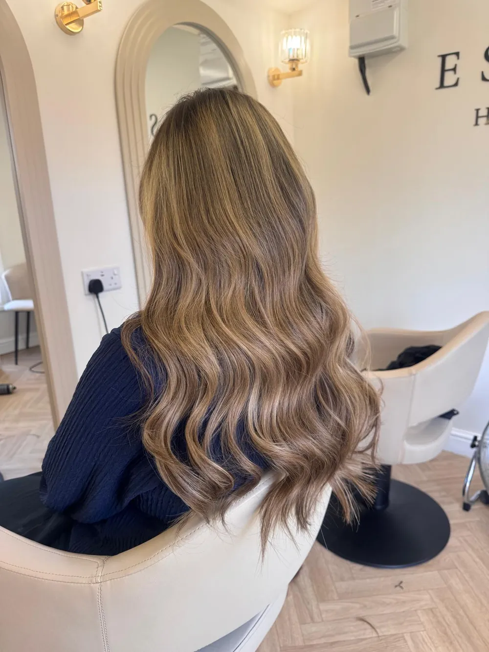 Bronde balayage on long, wavy hair